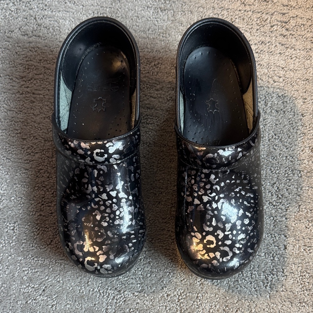 Dansko patent leather cheetah clogs